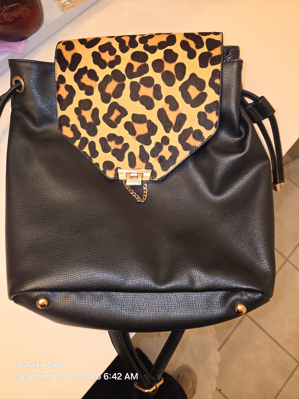 Dune London Black Backpack with Leopard Print Flap